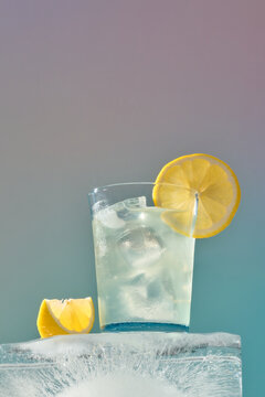 A close-up shot of a refreshing lemonade with ice and lemon slice