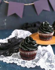 Dark chocolate cupcakes with purple icing