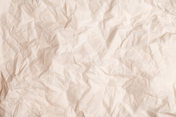 Wrinkled beige paper texture background
