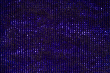 Dark purple fabric texture with woven pattern
