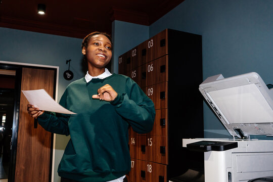 Woman Stretching Near Office Printer