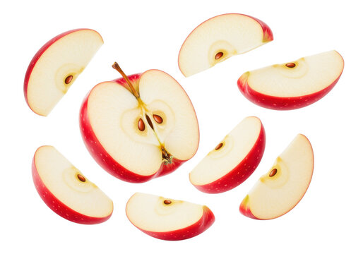 Slices of red apple floating in the air showing fresh and healthy fruit