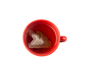 Herbal tea sachet in cup, hot water with chamomile and Hypericum or St. John's wort teabag