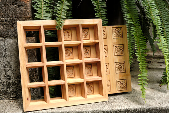 Closeup of a traditional Chinese cake wooden mold in the courtyard