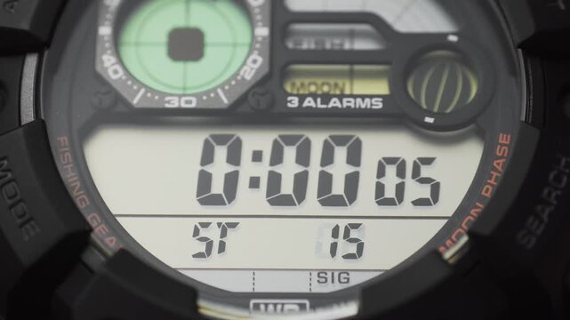 Macro close up of a tactical digital watch face functioning

