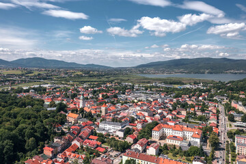 Picturesque historic center and skyline aerial views of Żywiec, Poland—a charming town by the Beskid mountains and Żywiec Lake. Old town, cathedral tower and a scenic landscape on a summer day.