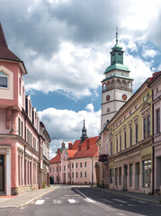 Picturesque historic center of Żywiec, Poland—a charming old town, featuring cathedral tower on a summer day.