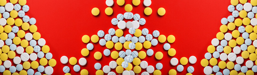 Close-up of medical yellow pills. Top view.