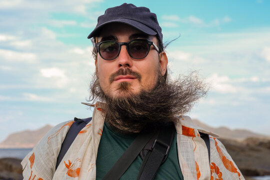 Man in Windy Weather on the Coast