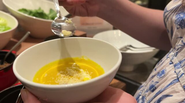 pumpkin soup sprinkle with Parmesan cheese Chef garnishing encebollado con yuca traditional ecuadorian soup