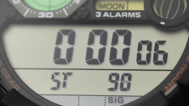 Macro close up of a tactical digital watch face functioning

