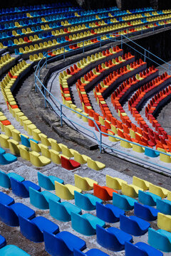 Many colorful chairs in a row