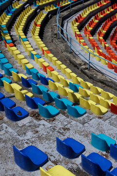 Many colorful chairs in a row