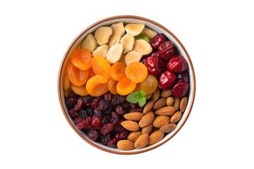Overhead shot of a bowl filled with dried fruits and nuts isolated on transparent background