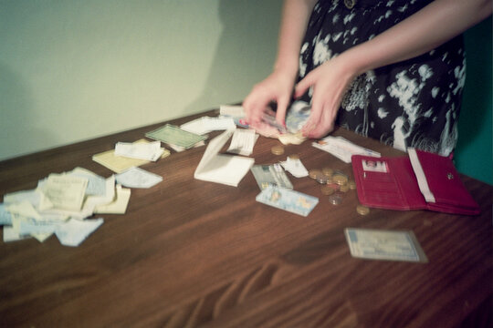 Organizing Cash and Documents on a formica Table