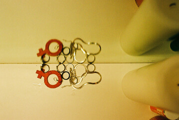 Creative Arrangement of Gender Symbol Earrings and Accessories