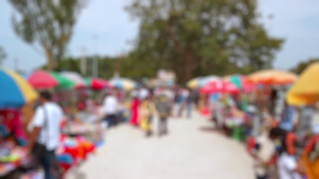 Bokeh view of devotees visit Sri Chamundeshwari Temple, located on Chamundi Hills near Mysore, India. Blurred background footage.