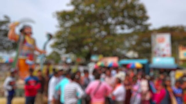 Bokeh view of devotees visit Sri Chamundeshwari Temple, located on Chamundi Hills near Mysore, India. Blurred background footage.
