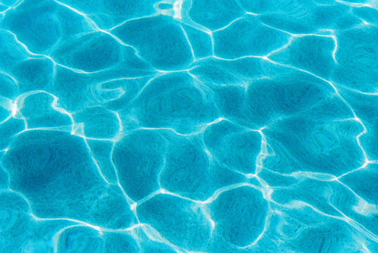 Abstract shapes in blue pool water