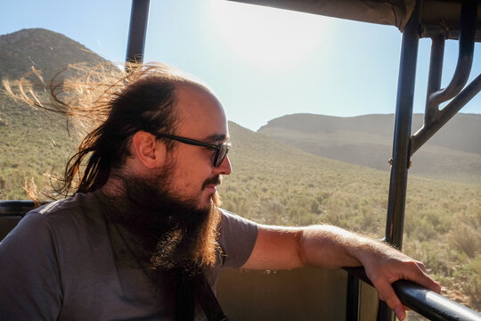 Bearded Man Observing Safari Landscape