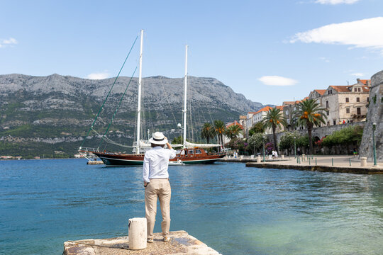 man walking by the sea