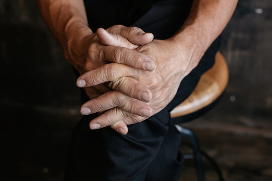 Anonymous man with interlaced fingers