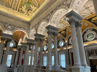 Grand marble columns and ornate ceilings of the Library of Congress in Washington D.C., showcasing stunning architecture, intricate murals, and historic artistry in America’s most beautiful library