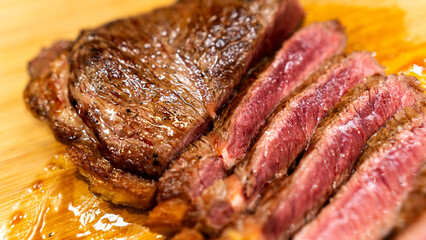 Juicy rare beef steak with perfect sear and appetizing pink center. Succulent meat showcase for gourmet photography, butchers, and premium restaurant marketing