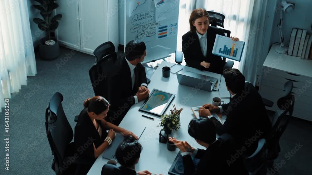 Aufkleber top view of smart executive manager looking at financial graph while skilled business team give high
