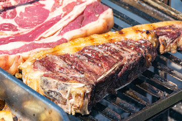 A perfectly seasoned piece of beef on a hot grate, a simple and delicious recipe.