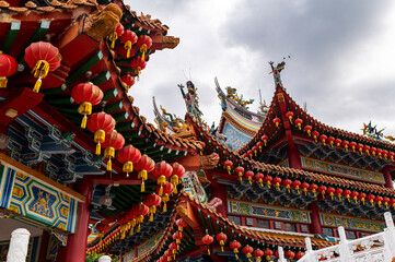 Red chinese lanterns and temple rooftops