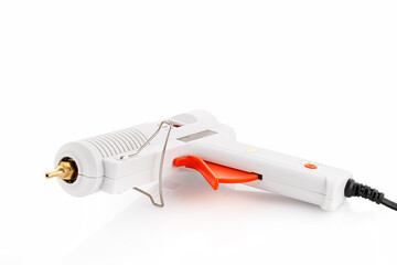 An electric hot glue gun. An hot glue gun isolated on a white background isolated on a white...