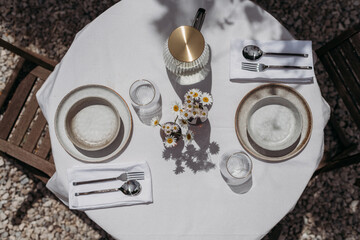 A table set up outside for outdoor dining.