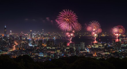 Fototapeta premium Fireworks Display Over City Skyline at Night, Celebratory Event.