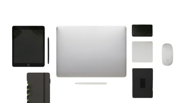Sleek tech essentials: Laptop, tablet, mouse, and notebook ready for modern productivity and creativity