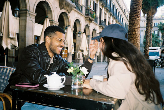 Couple enjoying a romantic date at outdoor cafe in Barcelona city ugc