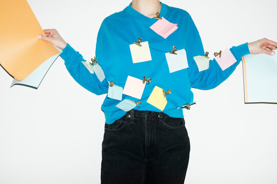 Person having post it notes on the shirt in at work with flash