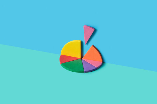 Flat foam pie chart with lifted slice on blue