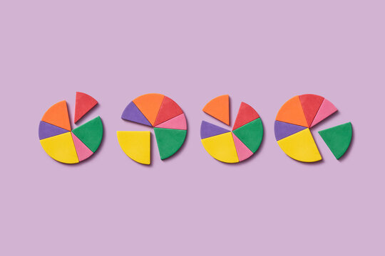 Colorful foam pie charts on purple background