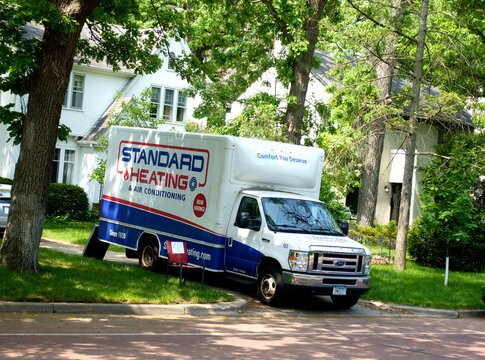 Standard Heating and Air Conditioning truck installing or servicing equipment in the neighborhood. St Paul Minnesota MN USA
