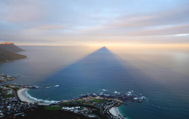 Ocean at sunset, with shadows and light on the clouds