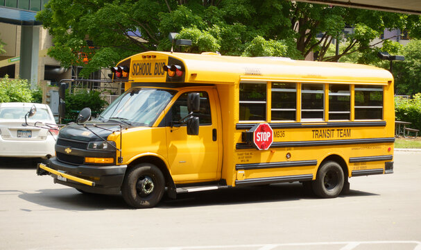 Parked yellow school bus for transporting students to and from school. St Paul Minnesota MN USA