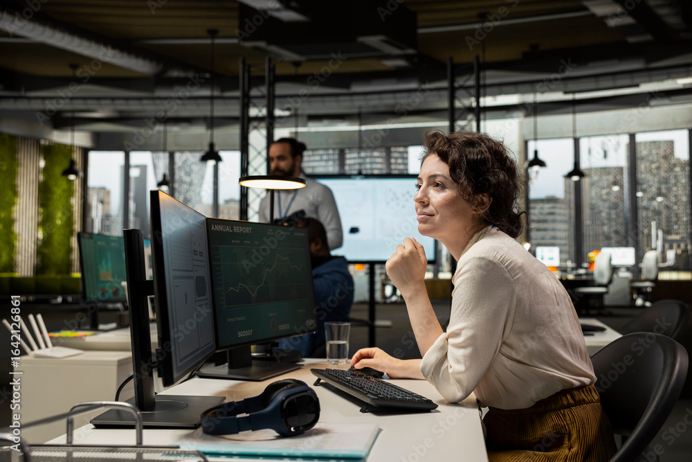 Poster motivated employee analyzing performance metrics and reports, applying business strategy and insight