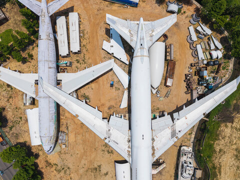 Aerial View of Aircraft Boneyard with Salvaged Planes and Equipm