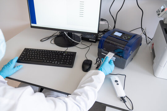 Scientist Using Data Printer in Laboratory Setting