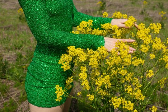 Fashion portrait of anonymous woman in green dress