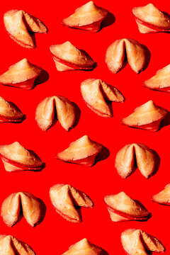 several fortune cookies on a red background
