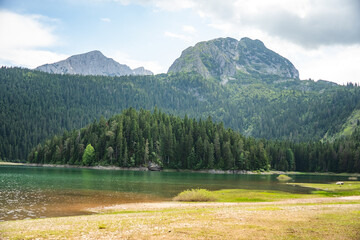 Mountains rising over Black Lake in Durmitor National Park, in Zabljak, Montenegro