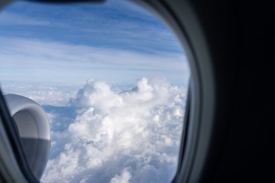 Fototapeta Clouds View From an Airplane Window During a Clear Day