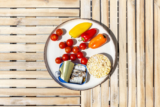 Fresh Vegetables and Seafood Arranged on a Plate Outdoors